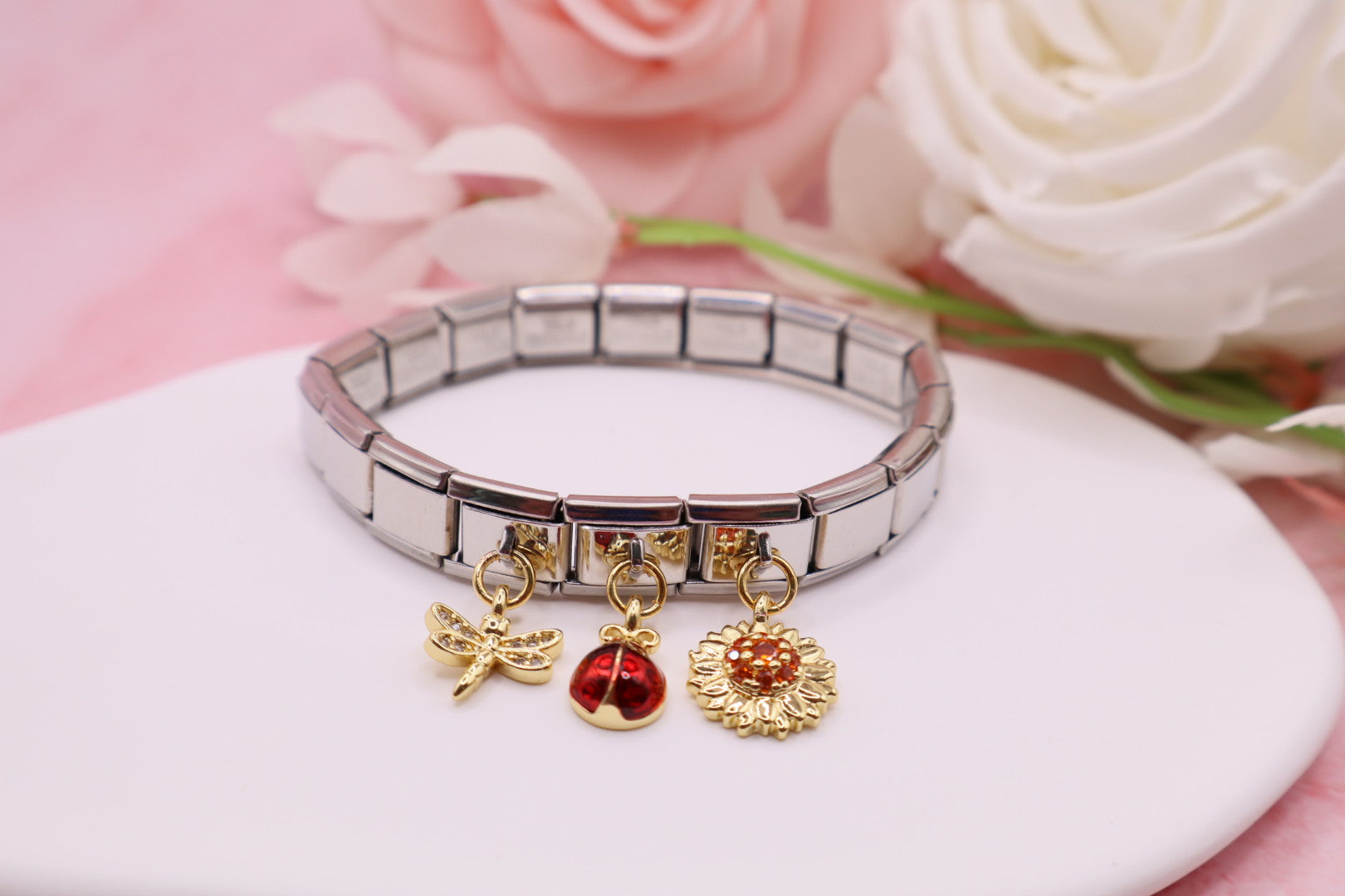 Pulseras de eslabones italianos en acero inoxidable con diferentes dijes.